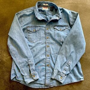 Wrangler~ classic light wash denim snap down shirt featuring a laid-back look.